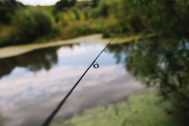 Close-up of a fishing rod ring near lake