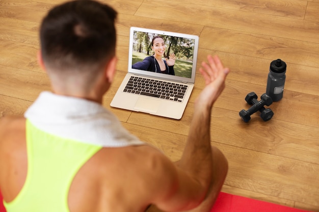 Free photo close up fitness intructors with laptop