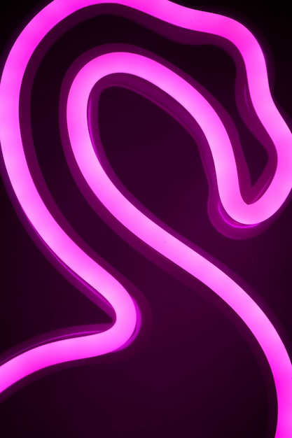 Free photo close up on flamingo neon sign in bedroom