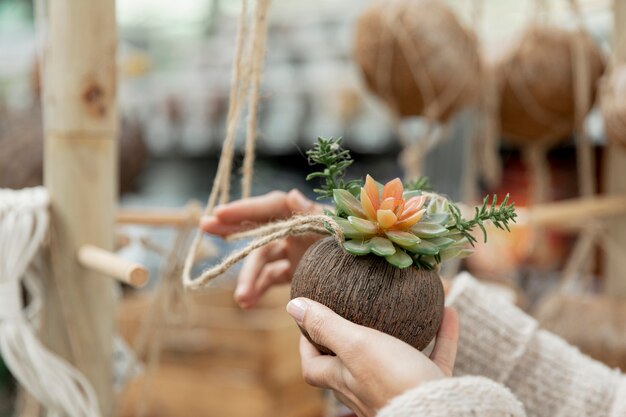 Close-up florist making arrangements indoors