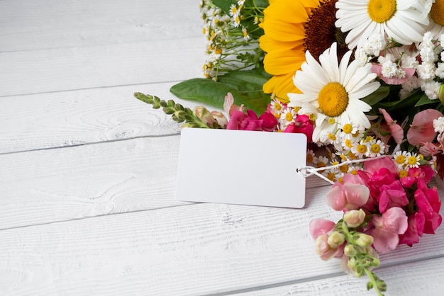 Close-up of flowers bouquet with tag