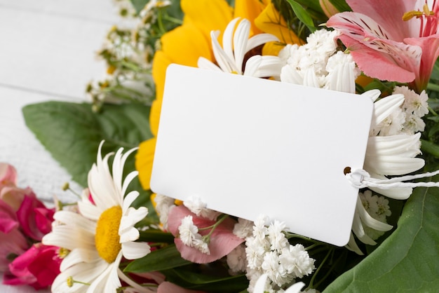 Close-up of flowers bouquet with tag