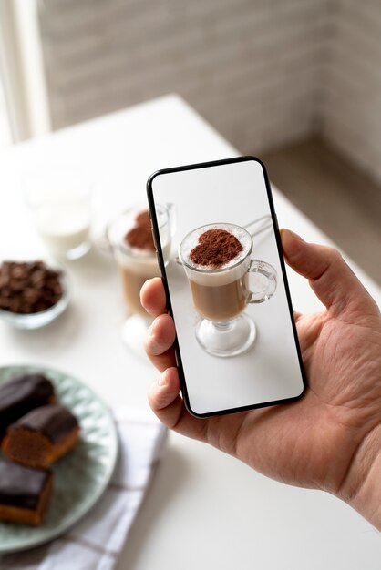 Close up on food lover taking pictures of meal