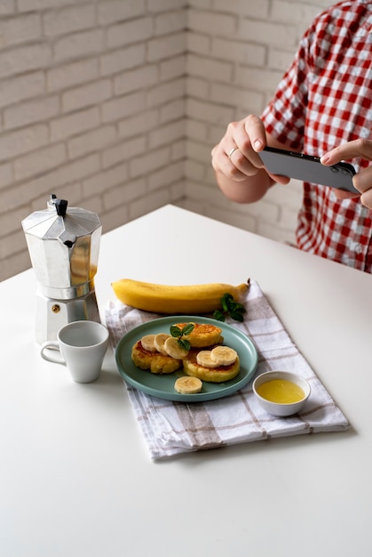 Close up on food lover taking pictures of meal