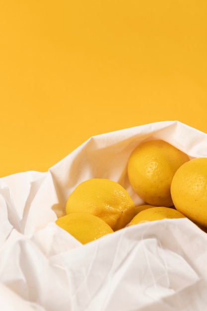 Free Photo close-up fresh lemons in a bag