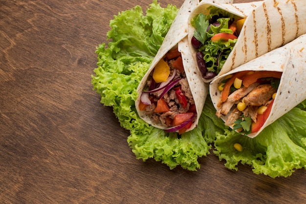 Close-up fresh tortilla wraps with vegetables and meat