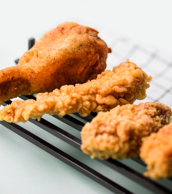 Close-up fried chicken pieces on tray