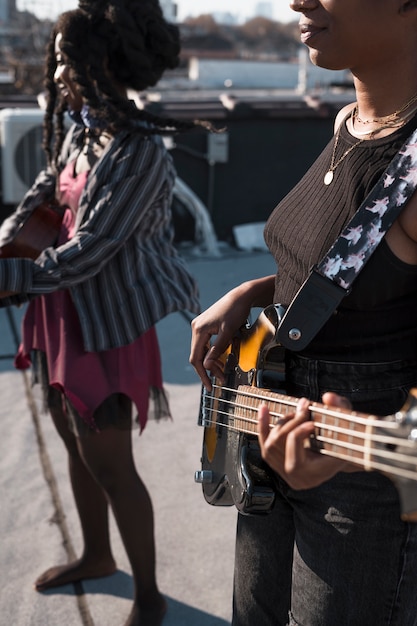 Close up friends making music