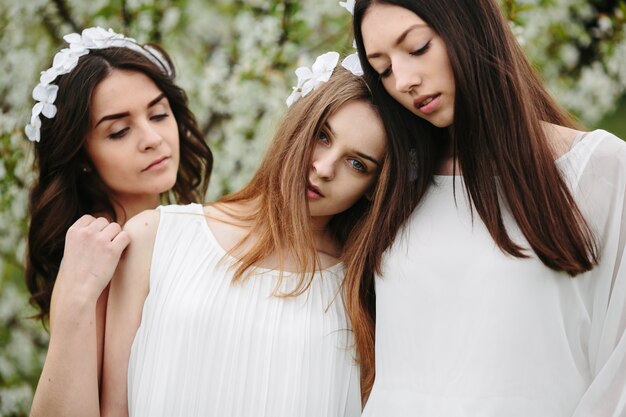 Close-up of friends posing in the field