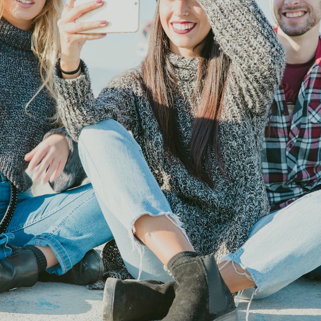 Free photo close up of friends taking selfie