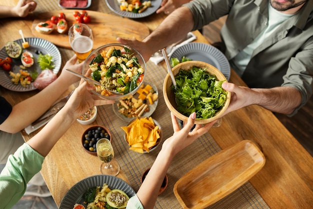 Close up  friends with delicious salad