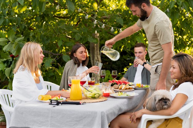 Close up friends with food and drinks