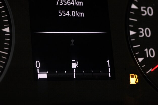 Close up on fuel level gauge in vehicle