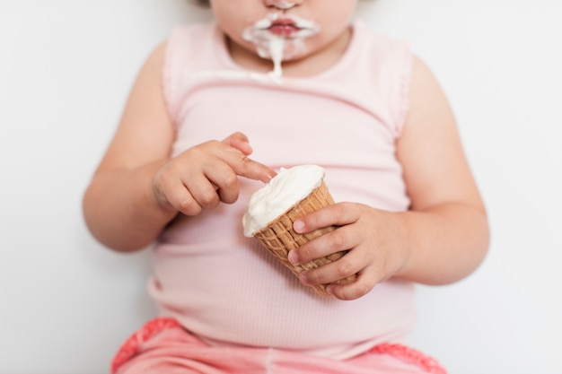 Close-up girl holding an ice cream