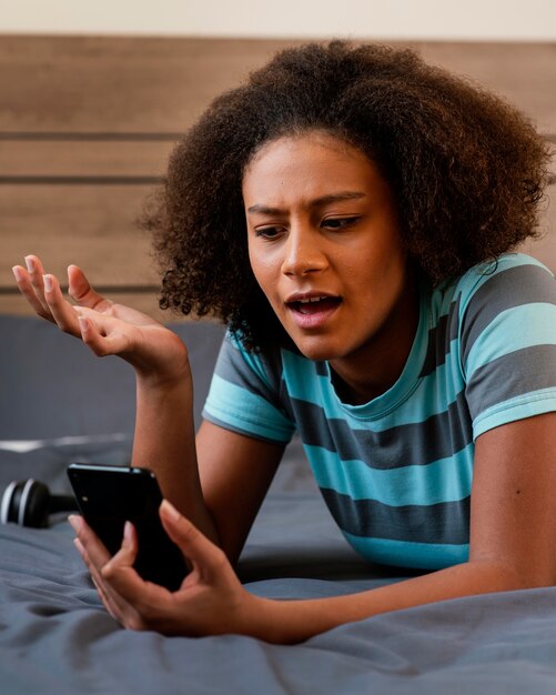 Close-up girl holding smartphone