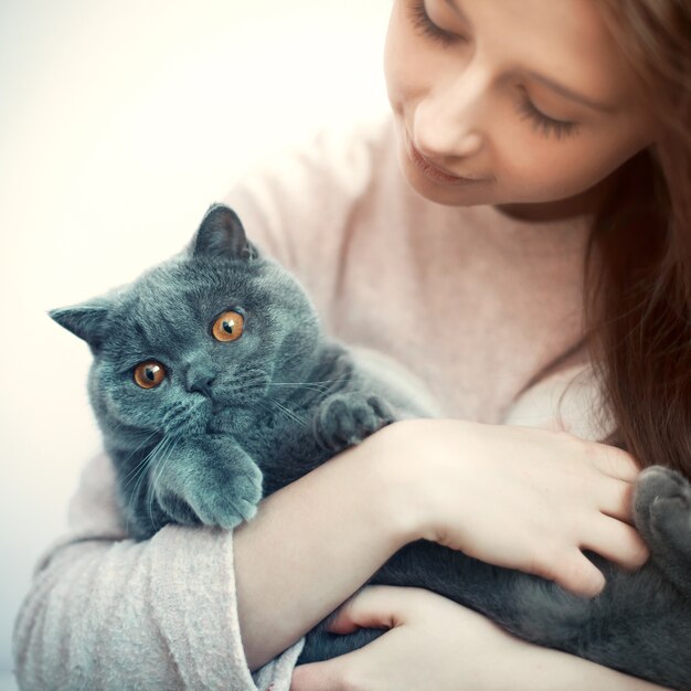 Free Photo close-up of girl hugging her cat