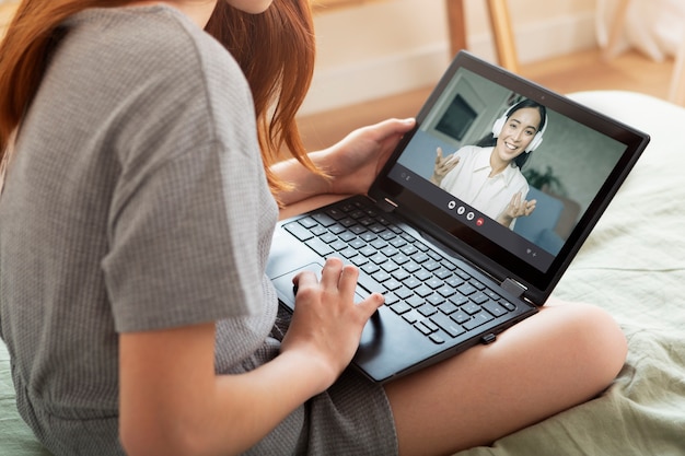 Close up girl learning with laptop indoors