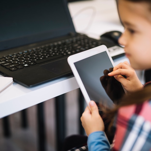 Close-up of a girl using digital tablet