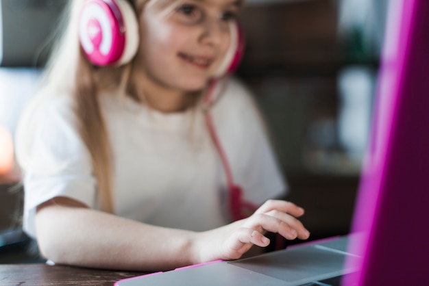 Free Photo close up of girl using laptop