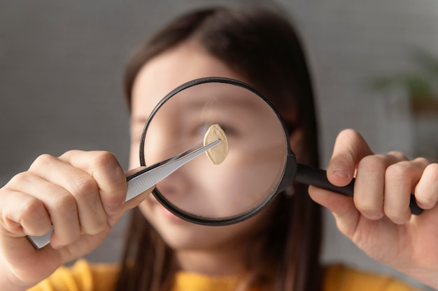 Free photo close up girl watching seed