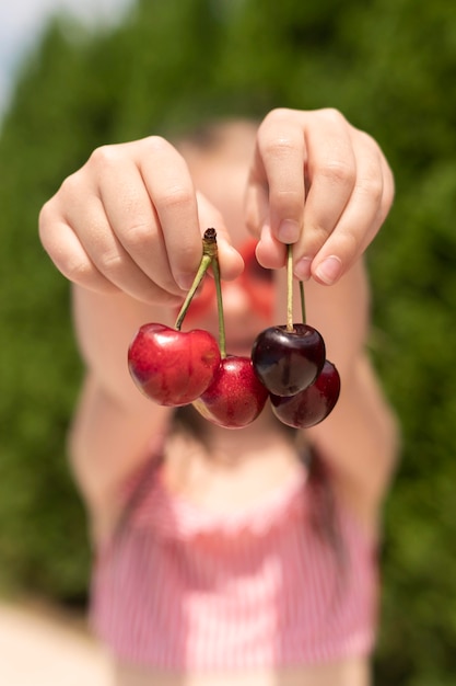 Free Photo close-up girl with cherries