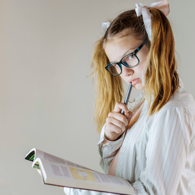 Free Photo close-up of a girl with exercise book