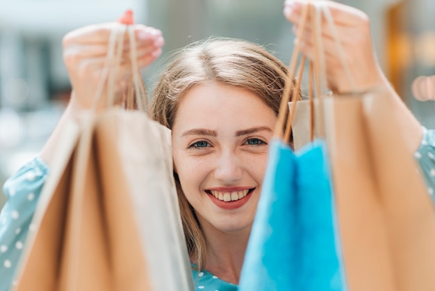 Close up girl with shopping bags 