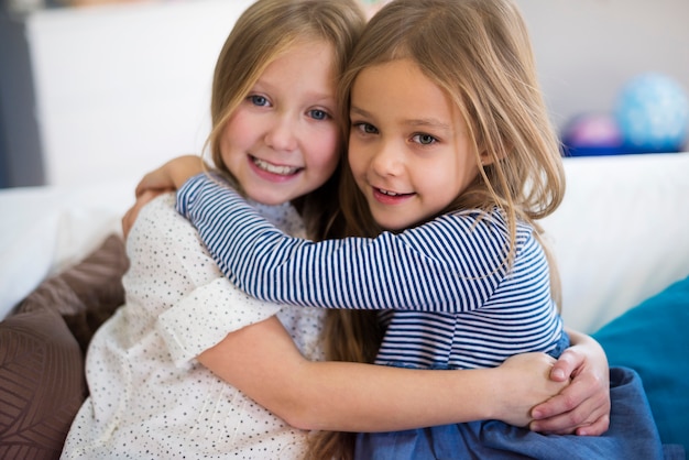 Close up of girls embracing each other