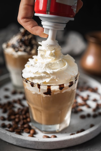 Close-up glass of coffee with cream