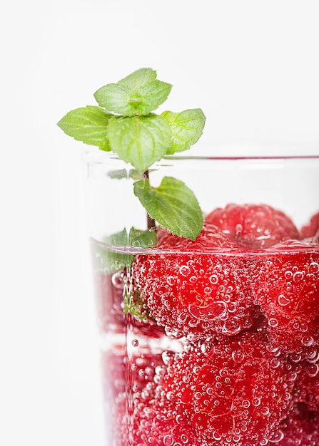 Close-up glass filled with water and fruit