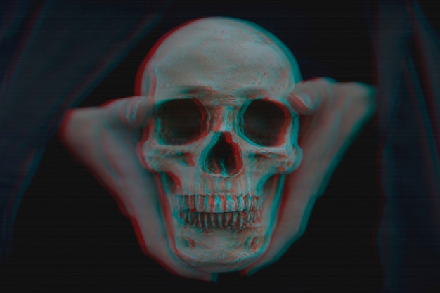 Free photo close-up of glitched skull held in hands