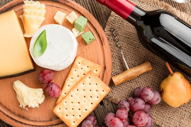 Free Photo close-up gourmet cheese assortment with wine