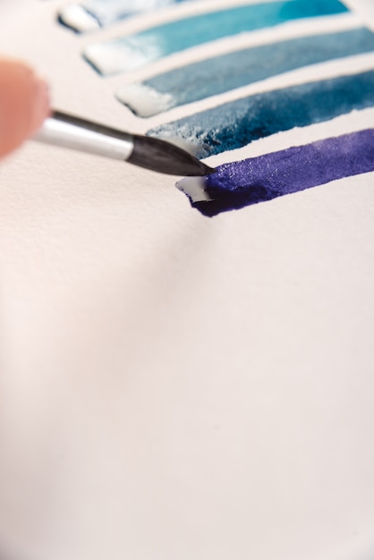 Free Photo close up of gradient blue stripes on white paper