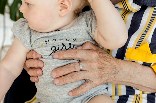 Free photo close-up grandmother holding grandchild