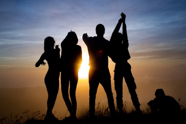 Close-up. a group of tourists meet the dawn on the volcano Batur. Bali Indonesia