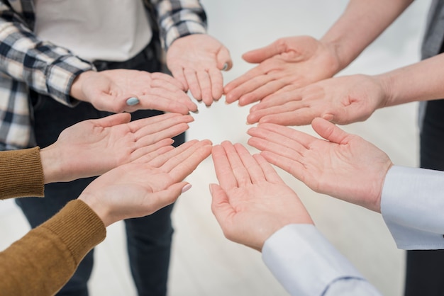 Close-up group of women with hands up