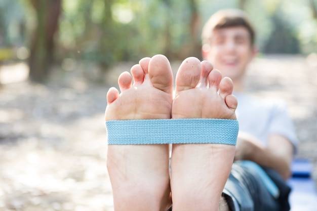 Free Photo close-up of guy's feet doing stretches