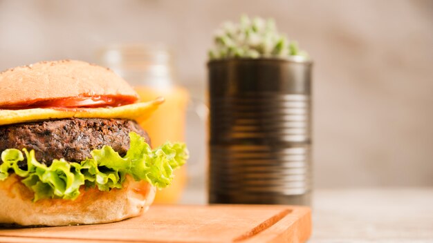 Close-up of hamburger on chopping board