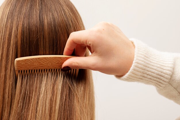 Close up on hand brushing hair