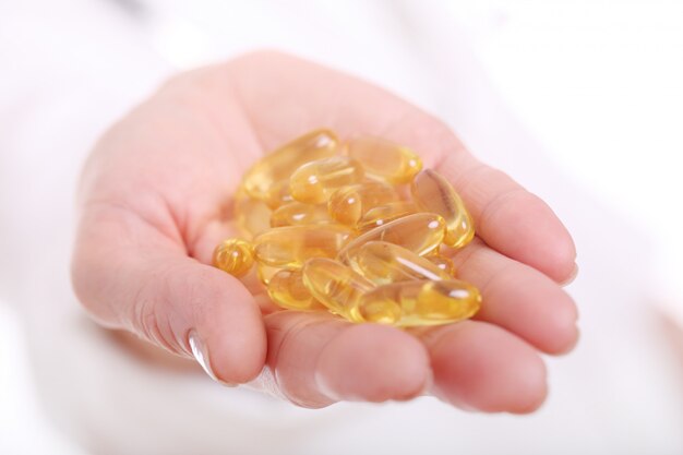 Close up of hand of a doctor with pills