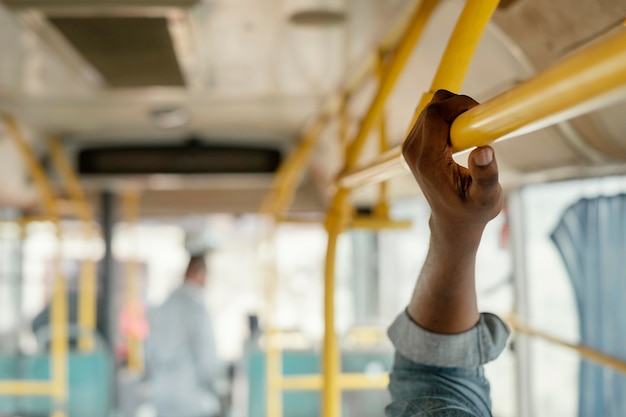 Free Photo close up hand holding bus bar