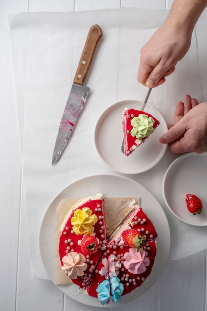 Free photo close up hand holding cake slice