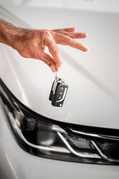 Close-up hand holding car keys