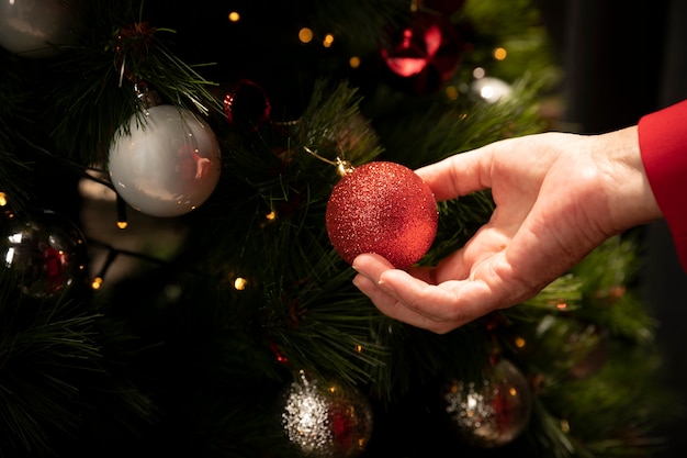 Close-up hand holding christmas ball