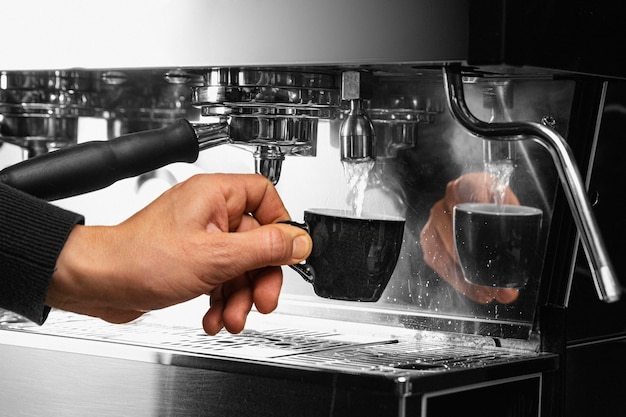 Close-up hand holding coffee cup