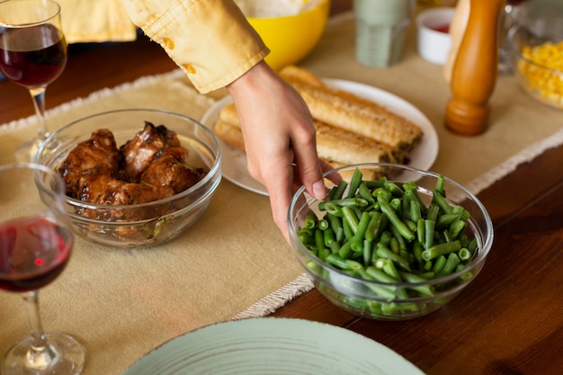 Free Photo close up hand holding food bowl