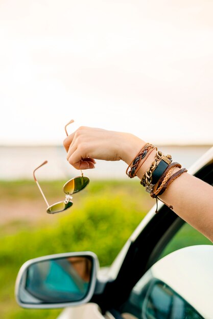 Close-up hand holding glasses