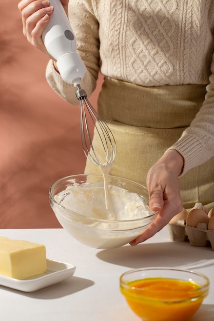 Close up hand holding hand mixer