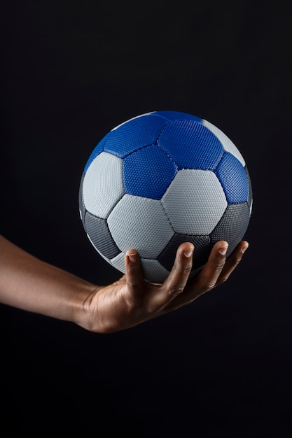 Free photo close up on hand holding handball ball