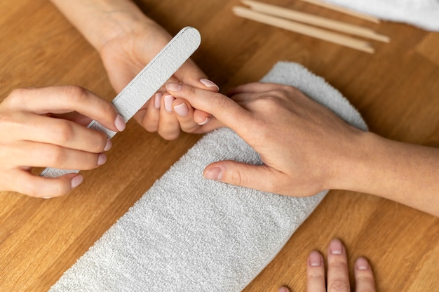 Close up hand holding nail file